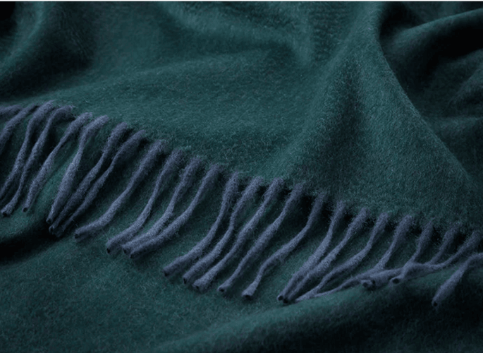 A-deep-green-coloured-luxury-cashmere-blanket-made-for-superyachts-yachts-homes-and-private-jets