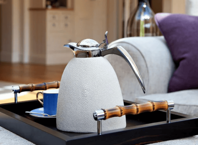 A luxury leather shagreen water jug set and decorative tray used as general serving accessories for superyachts and homes