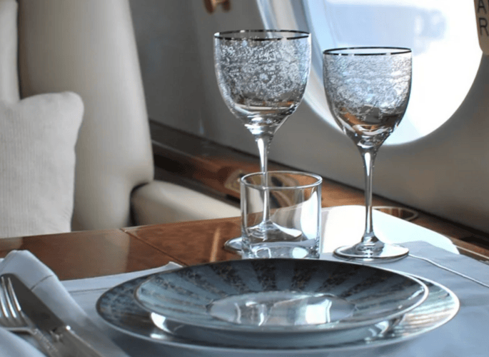 A-luxury-dining-set-up-on-a-private-jet-with-products-from-Glancy-Fawcett-including-tableware-porcelain-table-linen-and-crystal.