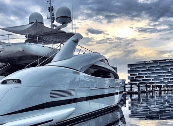 A view of a superyacht outside of Glancy Fawcetts Show Space featuring tableware linens and accessories for superyachts residences and private jets in Luxury Resort Albany Bahamas