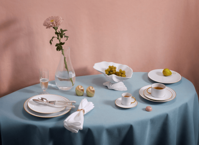  Luxury tableware tablescape with neutral white plates in fine bone china and porcelain